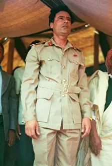 Kneels: Muammar Gaddafi and Men praying - Sousa, Libya