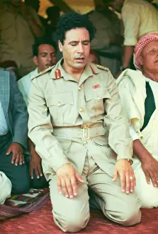 Kneel: Muammar Gaddafi and Men praying - Sousa, Libya