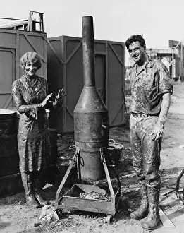 Filthy: Mud covered couple with portable stove
