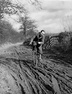 Negotiates: MUDDY CYCLIST