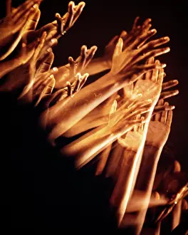 Uplifted: Multiple Exposure of African-American clapping