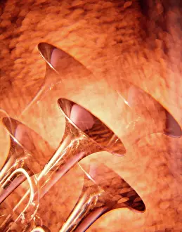 Heralding: Multiple Exposure of Brass Trumpets on Golden Background