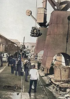 Dockyards: Munitions being loaded onto battleship, WW1
