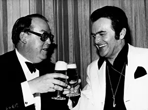 Greger: Musician Max Greger toasting with a friend