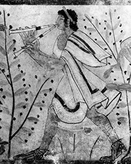 Tarquinia: A musician playing the double