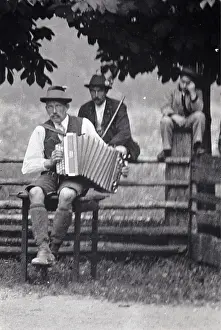 Harmonica: Musician with Styrian harmonica. About 1910