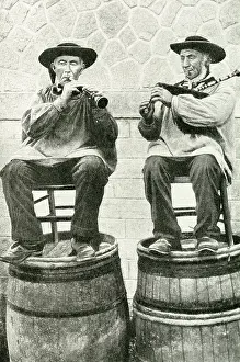 Breton: Musicians seated on barrels, Brittany, Northern France