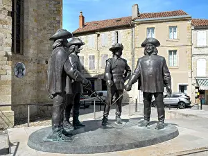 Trois: Three Musketeers sculpture, Condom, Gers, Occitania, France