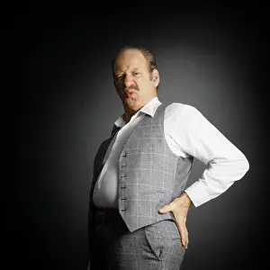 Sore: Mustached Middle-Aged Man Wearing Unbuttoned Suit