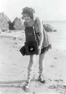 Garment: Myrtle Lind Poses with Graflex Camera, 1919
