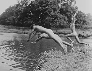 Naked boys diving and jumping into a river