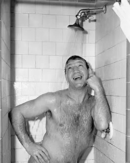 Bathrooms: Naked man taking a shower