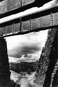 Rivets: Narrow country lane with bridge structure above