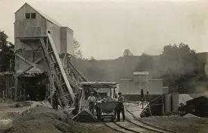 Corrugated: Narrow gauge railway with men and skip wagon