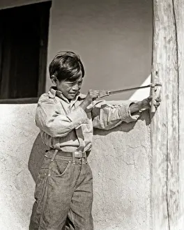 Ildefonso: Native American Indian Boy Using Aiming Sling Shot