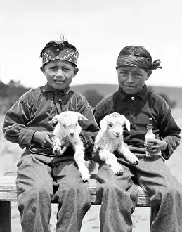 Pre Teen: Two Native American Navajo Boys Looking at Camera Holding
