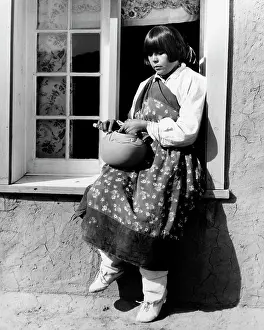Windowsill: Native American Woman Sitting on Windowsill Decorating