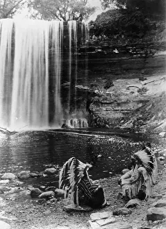 Sagas: Native americansin front of a waterfall