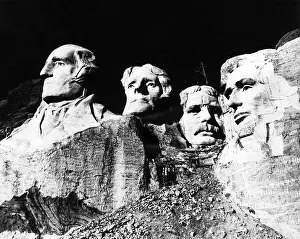 Rushmore: A nearly completed Mount Rushmore, with ?