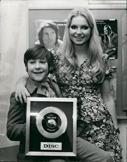 Echo: Neil Reid, schoolboy singer, with silver disc