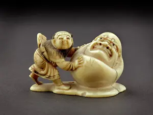 Daruma: Netsuke in the form of a boy rolling a yuki daruma - snowman