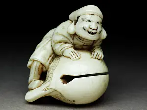 Daikoku: Netsuke in the form of Daikoku climbing onto a mokugyo