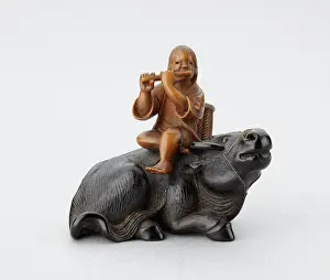 The Ashmolean Museum: Netsuke of a oshikyo sitting on an ox playing the flute