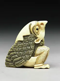 Tengu: Netsuke of a tengu mountain demon emerging from an egg