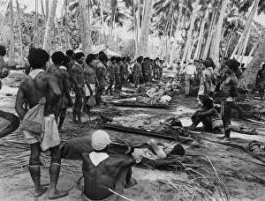 Guinean: New Guinean native stretcher bearers pause in