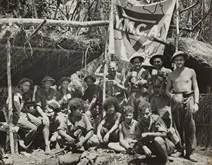 Guinean: New Guinean natives and Allied troops pause at