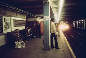 86th: New York City Subway. Passengers wait on ?