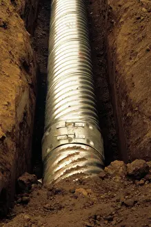 Ditches: Newly laid metal pipe in ditch