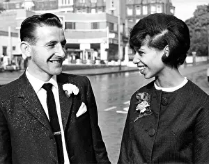 Buttonholes: Newly wed smiling bride and groom
