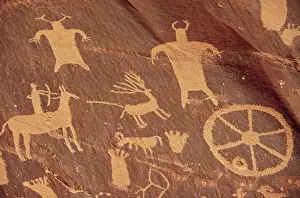 Pictographs: Newspaper Rock Is a large cliff mural of ?
