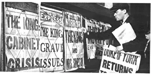 Constitution: Newspaper seller adjusting his headline posters