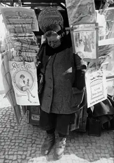 Newswoman: Newspaper vendor