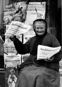 Vendors: Newspaper vendor in Berlin, 1936