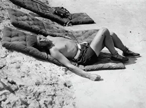 Antibes: Noel Coward sunbathing