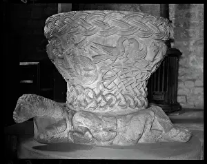 Frome: Detail of a Norman font with three feet
