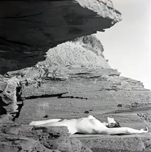 Nudity: Nude on the rocks