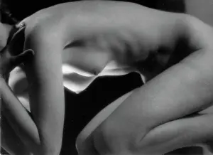 Cowering: Nude woman