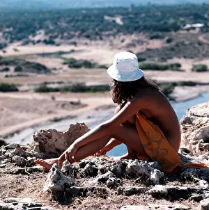 Suntan: Nude woman looking at the view in Spain