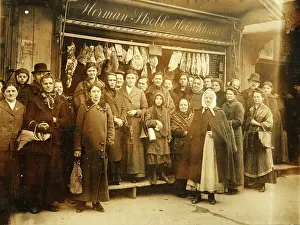 Butchery: A number of people in front of the butcher