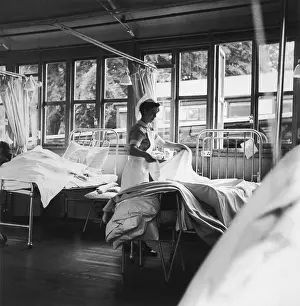 NURSE MAKING A BED