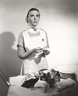 Syringe: Nurse preparing syringe for injection