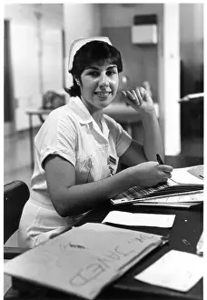 Tilley: Nurse seated at desk