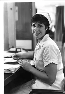 Tilley: Nurse seated at desk