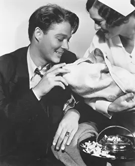 Ashtray: Nurse showing newborn to father