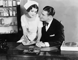 Coquettish: Nurse sitting on the doctor's lap