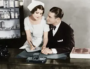 Coquettish: Nurse sitting on the doctor's lap